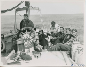 Image of Group on quarter- Stan at wheel, Miriam, Andy, Dave, Horace and Ed